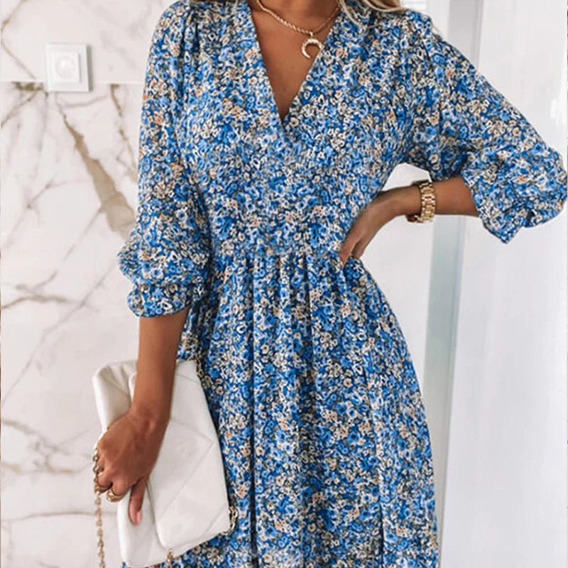 Pink floral dress from THE WHITMORE FAMILY's Sunna collection, featuring elegant design and lightweight fabric.