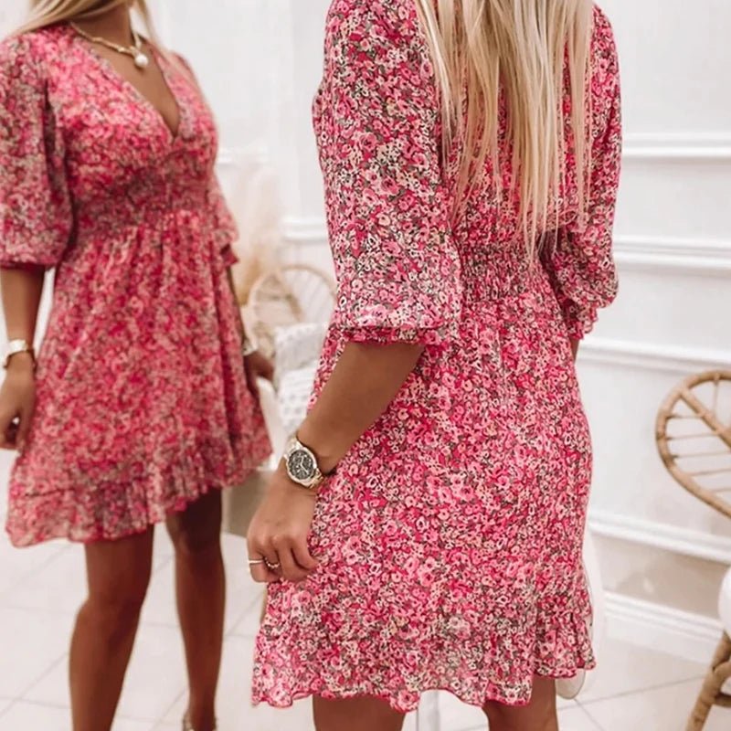 Pink floral dress by THE WHITMORE FAMILY, elegant design with delicate flower patterns, perfect for special occasions.