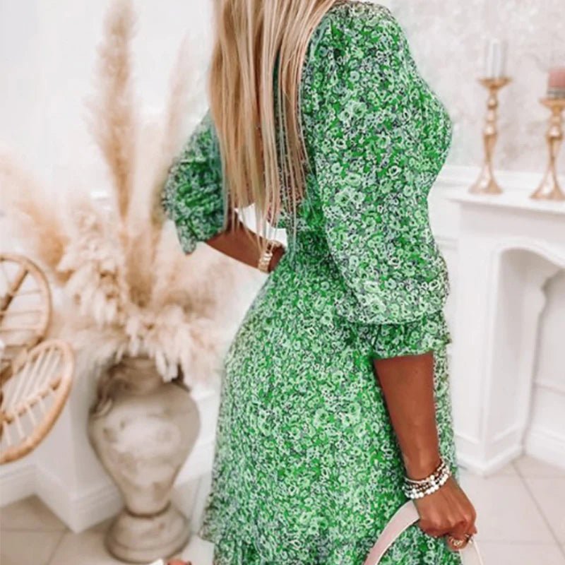 Pink Sunna Elegant Floral Dress by THE WHITMORE FAMILY featuring a flowy silhouette and intricate floral pattern.