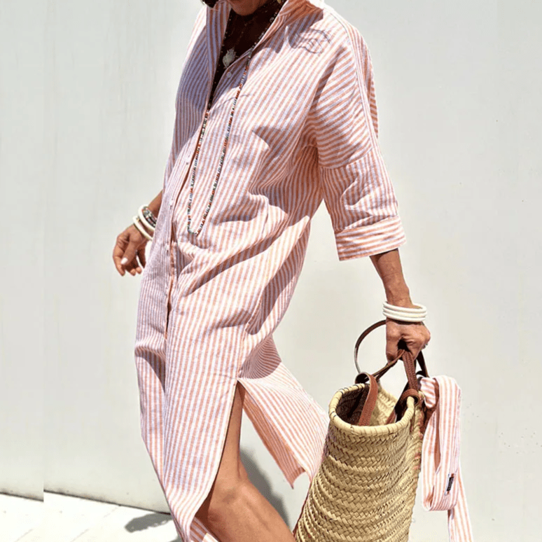 Pink Cariel maxi dress by THE WHITMORE FAMILY, featuring an elegant, breathable design and flowing fabric.