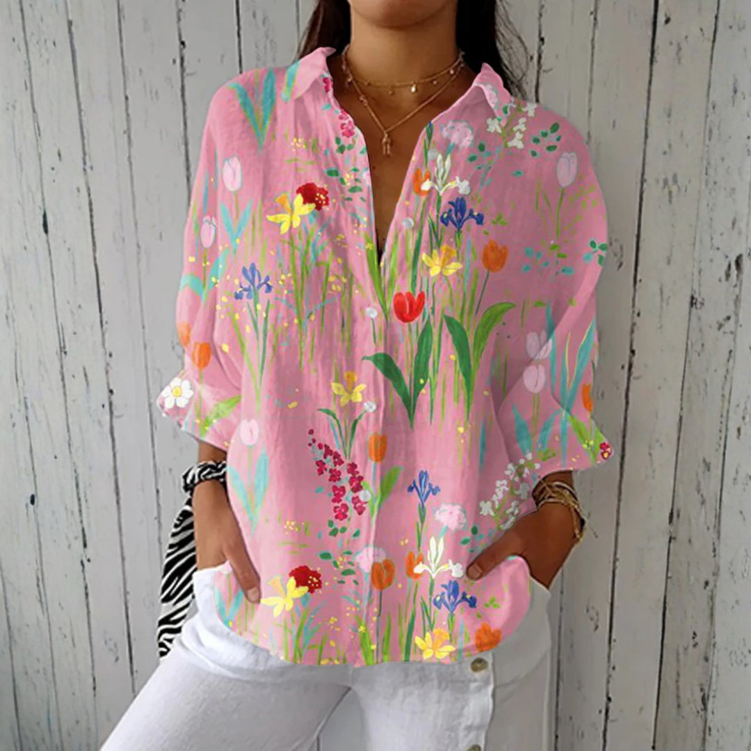 Pink Clara™ Spring Garden Blouse by THE WHITMORE FAMILY featuring floral print and lightweight fabric on a model.