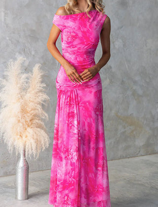 Elegant pink printed maxi dress by THE WHITMORE FAMILY featuring a flowing silhouette and intricate floral patterns.