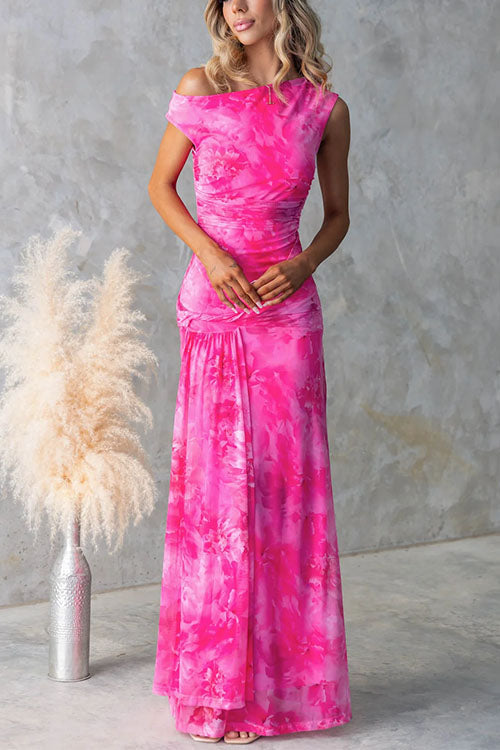 Elegant pink printed maxi dress by THE WHITMORE FAMILY featuring a flowing silhouette and intricate floral patterns.