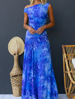 Pink printed maxi dress by THE WHITMORE FAMILY featuring elegant floral patterns and a flowing silhouette.