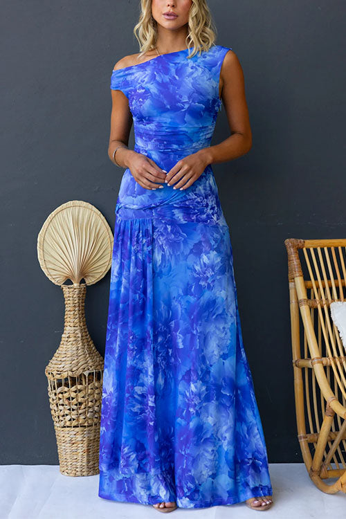 Pink printed maxi dress by THE WHITMORE FAMILY featuring elegant floral patterns and a flowing silhouette.