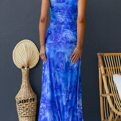 Pink Diana printed maxi dress by THE WHITMORE FAMILY, flowing fabric, elegant design, and floral pattern.