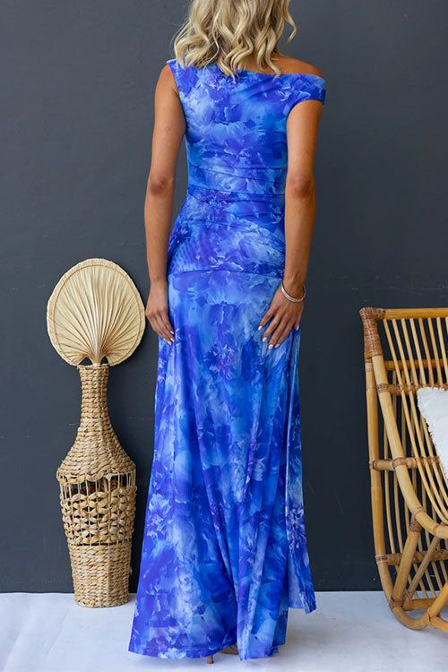 Pink Diana printed maxi dress by THE WHITMORE FAMILY, flowing fabric, elegant design, and floral pattern.