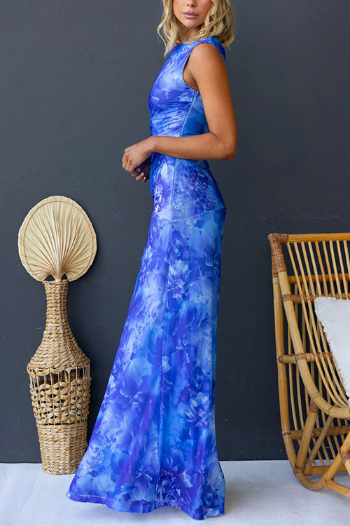 Pink printed maxi dress by THE WHITMORE FAMILY featuring elegant floral patterns and flowing fabric.