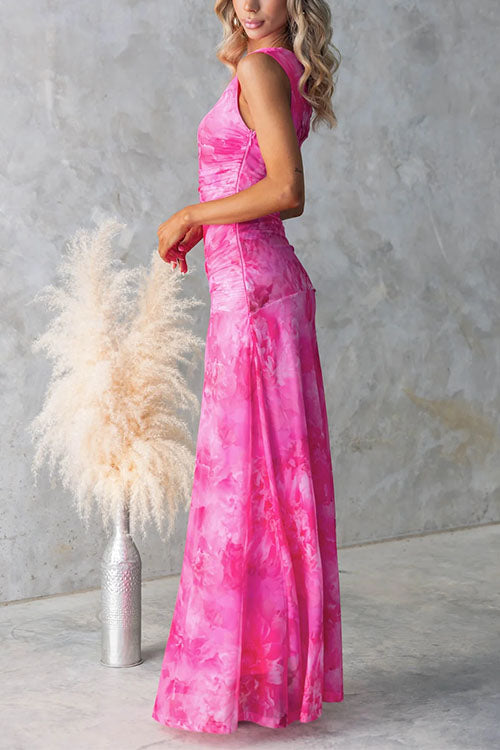 Pink printed maxi dress by THE WHITMORE FAMILY featuring elegant floral patterns and flowing fabric.