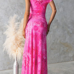 Pink Diana elegant printed maxi dress by THE WHITMORE FAMILY, flowing fabric with intricate floral pattern and stylish design.
