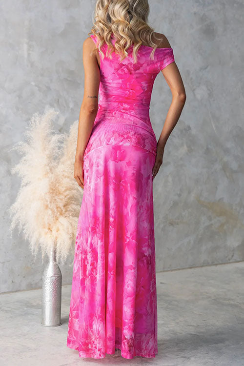 Pink Diana elegant printed maxi dress by THE WHITMORE FAMILY, flowing fabric with intricate floral pattern and stylish design.