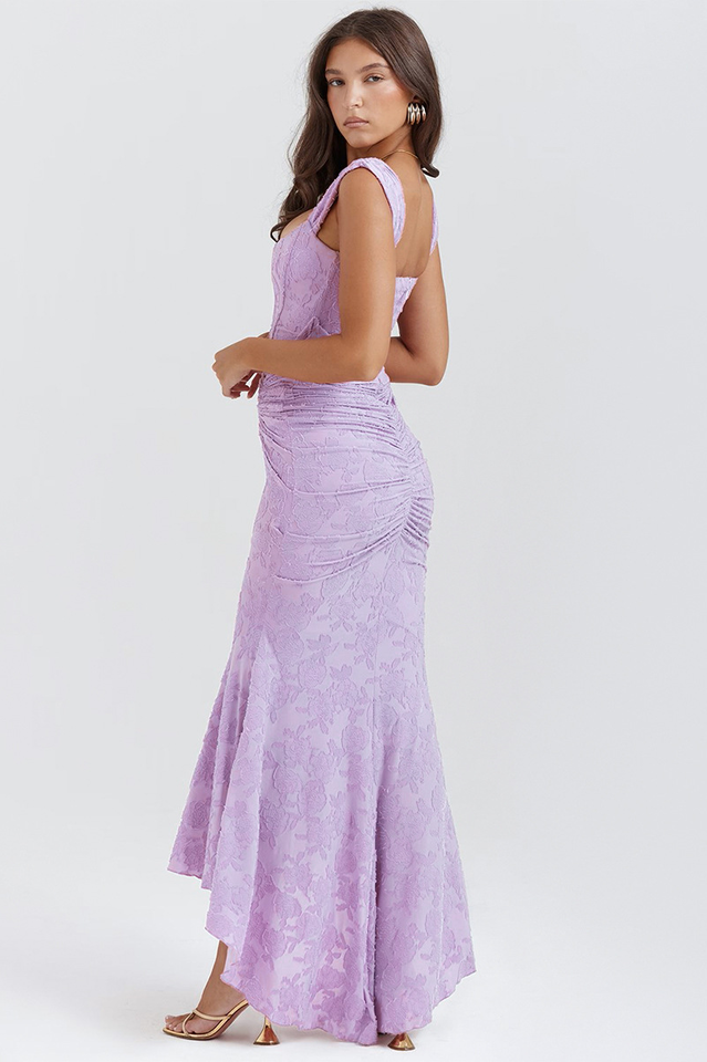 Elegant pink wedding dress named Gloria by THE WHITMORE FAMILY, featuring intricate lace details and a flowing train.