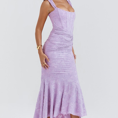 Elegant pink wedding dress called Gloria by THE WHITMORE FAMILY, featuring intricate lace details and a flowing train.