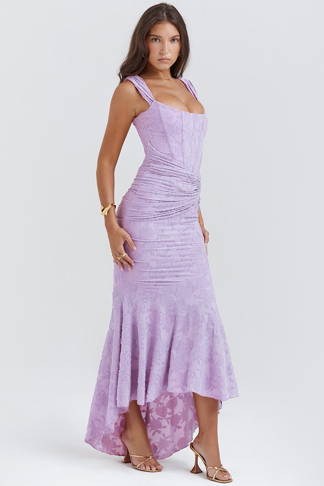 Elegant pink wedding dress called Gloria by THE WHITMORE FAMILY, featuring intricate lace details and a flowing train.