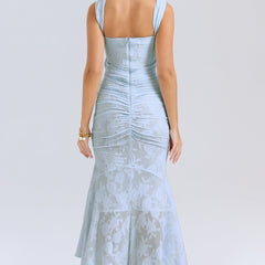 Elegant pink wedding dress named Gloria by THE WHITMORE FAMILY featuring intricate lace details and a flowing train.