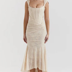 Elegant pink wedding dress named Gloria by THE WHITMORE FAMILY, featuring delicate lace and flowing fabric.