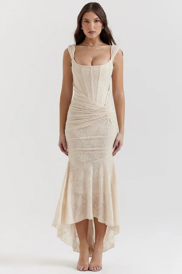 Elegant pink wedding dress named Gloria by THE WHITMORE FAMILY, featuring delicate lace and flowing fabric.