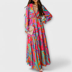 Pink Liv Helen Elegant Dress by THE WHITMORE FAMILY, featuring a stylish, flowing design with delicate details.