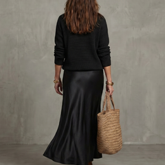 Pink bias fall satin skirt and knit layer set from THE WHITMORE FAMILY's Luciana collection, styled with a cozy, layered look.