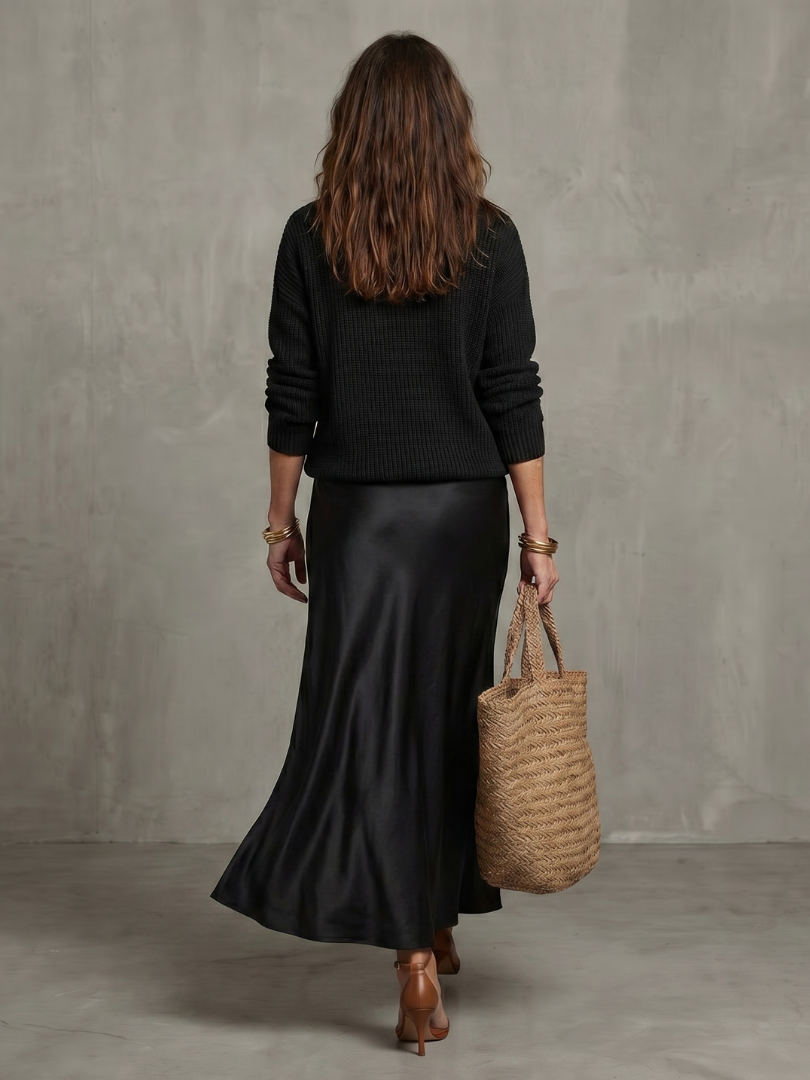 Pink bias fall satin skirt and knit layer set from THE WHITMORE FAMILY's Luciana collection, styled with a cozy, layered look.