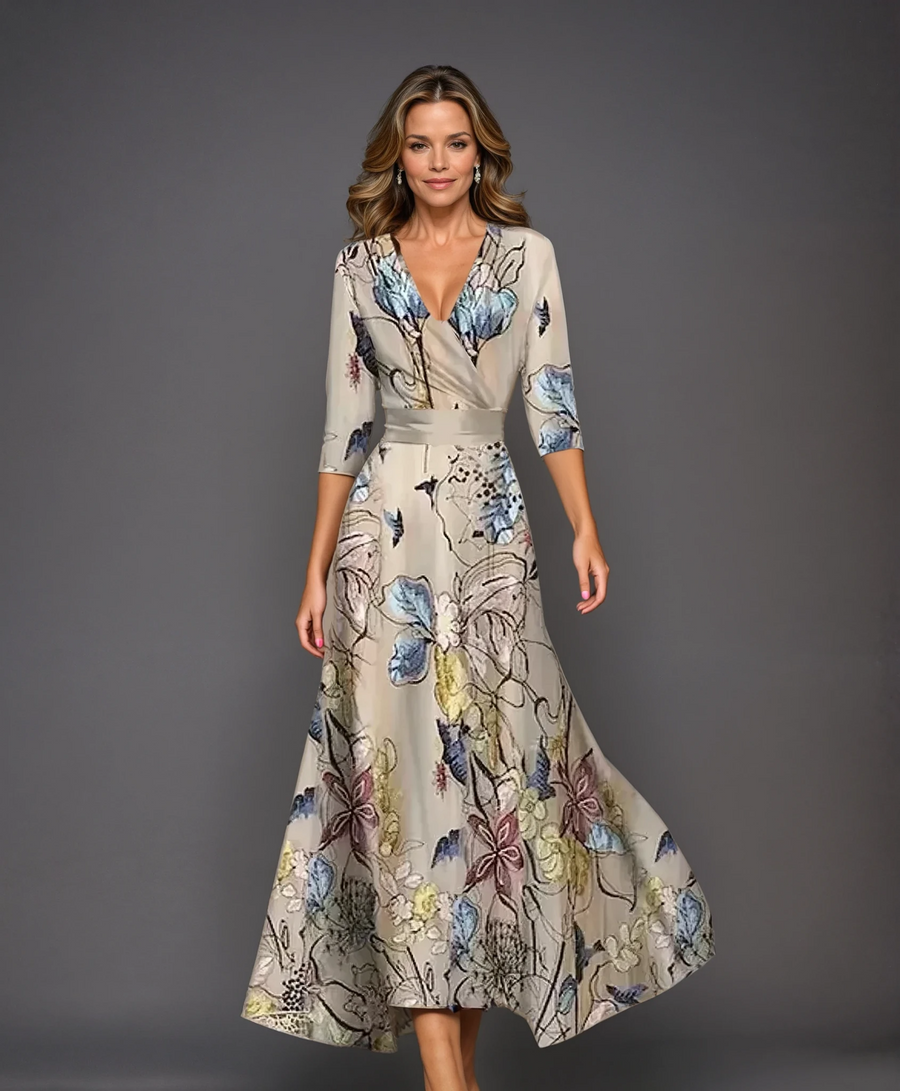 Pink Patricia chic dress with floral print by THE WHITMORE FAMILY, featuring a stylish, elegant design perfect for special occasions.