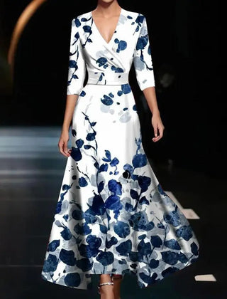 Pink Patricia chic dress with floral print by THE WHITMORE FAMILY, showcasing elegant fabric and detailed floral design.