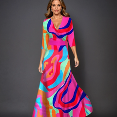 Pink Patricia chic dress with floral print by THE WHITMORE FAMILY, featuring a stylish design and vibrant pattern.