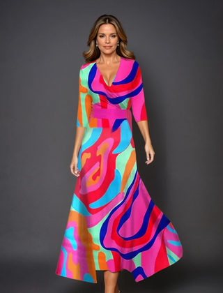 Pink Patricia chic dress with floral print by THE WHITMORE FAMILY, featuring a stylish design and vibrant pattern.