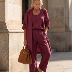 Pink three-piece relaxed top and pant set by THE WHITMORE FAMILY, featuring comfortable casual wear with a stylish fit.