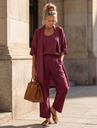 Pink three-piece relaxed top and pant set by THE WHITMORE FAMILY, featuring comfortable casual wear with a stylish fit.