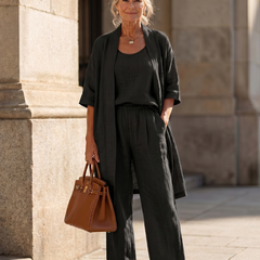 Pink three-piece relaxed top and pant set by THE WHITMORE FAMILY, featuring a comfortable, casual loungewear style.