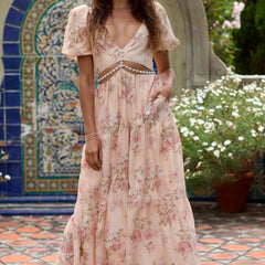 Pink Layla elegant flowing dress by THE WHITMORE FAMILY, showcasing lightweight fabric and stylish design.