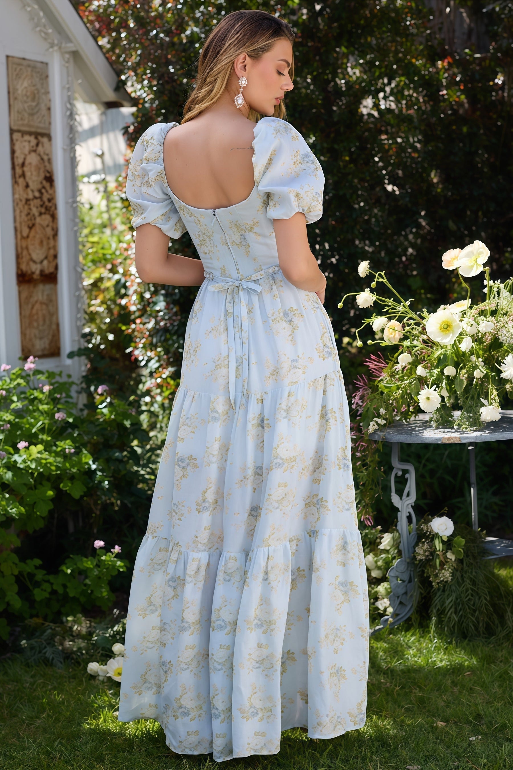 Pink Layla elegant flowing dress by THE WHITMORE FAMILY, featuring soft fabric and a graceful silhouette.