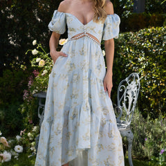 Pink Layla elegant flowing dress by THE WHITMORE FAMILY, shown on a model with soft fabric and stylish design.