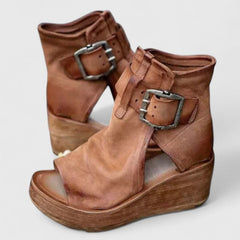 Purple Jess™ orthopedic wedge sandals by THE WHITMORE FAMILY with cushioned footbed and stylish design.