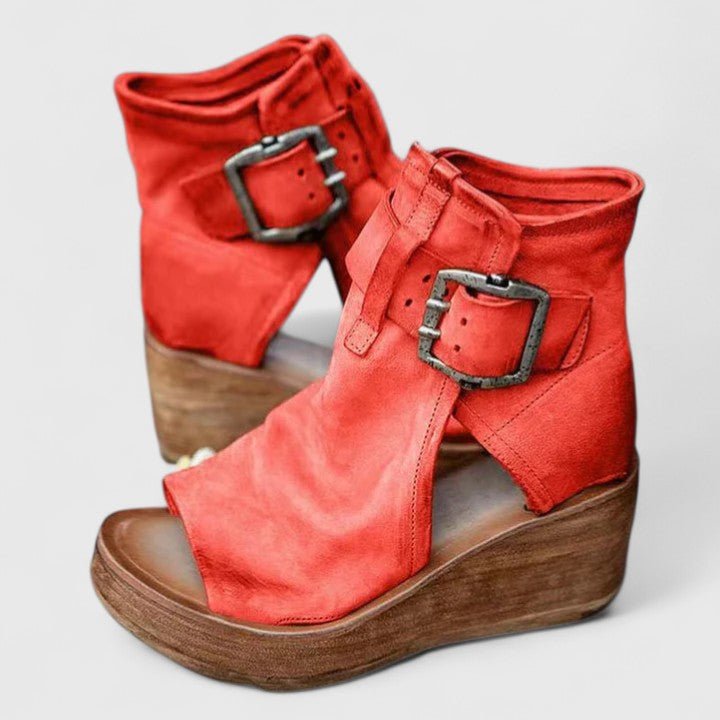 Purple Jess™ orthopedic wedge sandals by THE WHITMORE FAMILY with cushioned straps and supportive wedge heel.