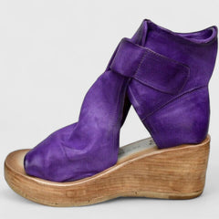 Purple Jess™ orthopedic wedge sandals by THE WHITMORE FAMILY with cushioned footbed and ankle straps for comfort.