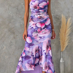 Purple floral one-shoulder dress by THE WHITMORE FAMILY featuring a stylish silhouette and elegant floral pattern.