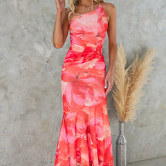 Purple floral one-shoulder dress by THE WHITMORE FAMILY, featuring a flowy design and elegant floral pattern.