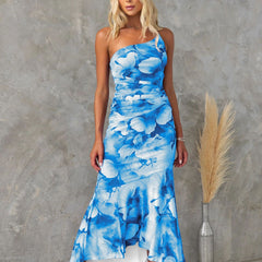 Purple floral one-shoulder dress by THE WHITMORE FAMILY, featuring a stylish design and elegant fit.