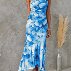 Purple floral one-shoulder dress by THE WHITMORE FAMILY, featuring elegant design and vibrant floral pattern.