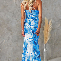 Purple floral one-shoulder dress by THE WHITMORE FAMILY featuring a flowing design and elegant floral pattern.