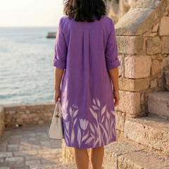 Purple Galatea evening garden walk dress by THE WHITMORE FAMILY, flowing fabric and floral design perfect for elegant occasions.