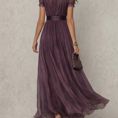 Purple Julie chiffon maxi dress with lace trim by THE WHITMORE FAMILY, shown on a model displaying flowing fabric and elegant design.