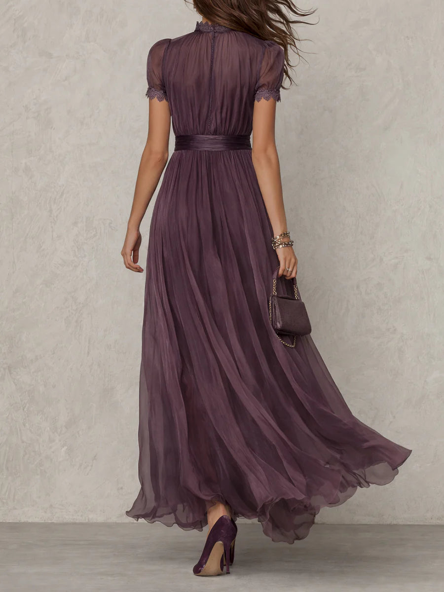Purple Julie chiffon maxi dress with lace trim by THE WHITMORE FAMILY, shown on a model displaying flowing fabric and elegant design.