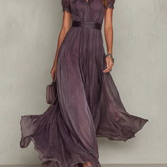 Purple Julie chiffon maxi dress with lace trim by THE WHITMORE FAMILY, featuring flowing fabric and elegant design.
