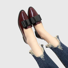 Red Anya orthopedic loafers by THE WHITMORE FAMILY featuring a sleek design and comfortable fit, shown on a neutral background.