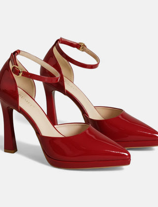 Red leather Evette heels by THE WHITMORE FAMILY with pointed toes and stylish stiletto heels, perfect for elegant occasions.