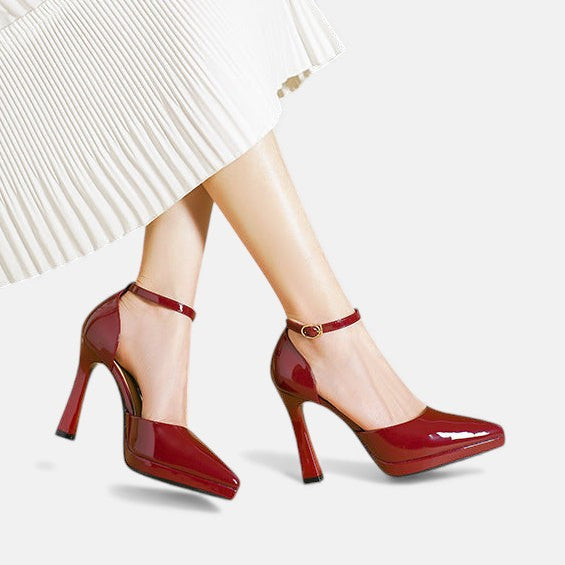 Red leather heels from THE WHITMORE FAMILY's Evette collection, featuring stylish pointed toes and a sleek heel design.