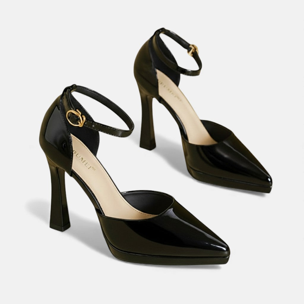 Red leather heels from THE WHITMORE FAMILY Evette collection, featuring sleek pointed toes and stylish stiletto heels.